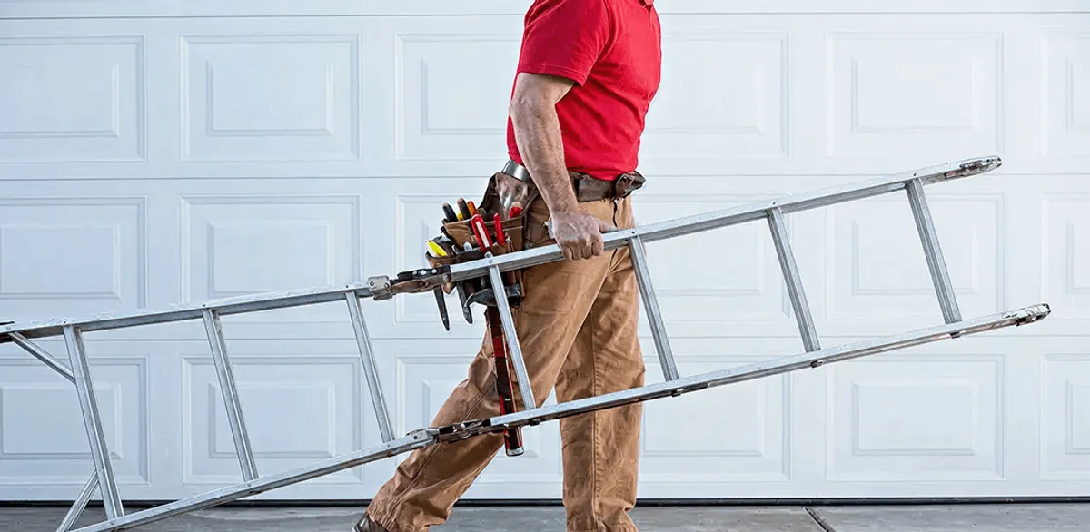 Garage door repair technician arriving with tools and ladder in Saint Petersburg, FL